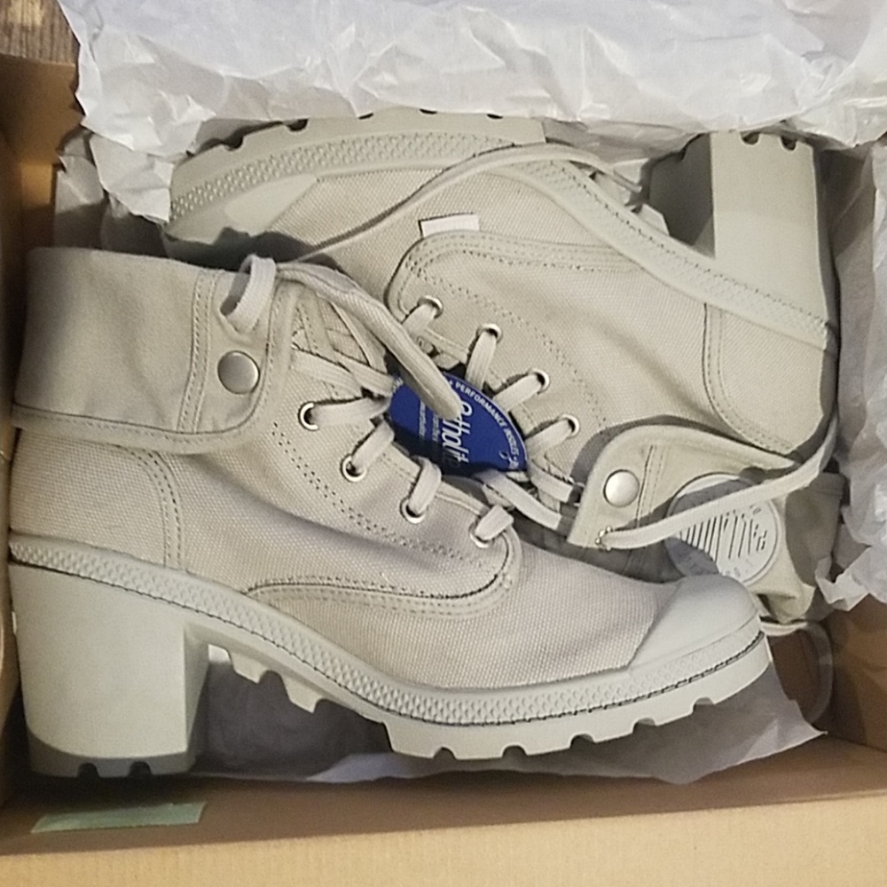 Brand new never worn gray hi top heeled sneakers.